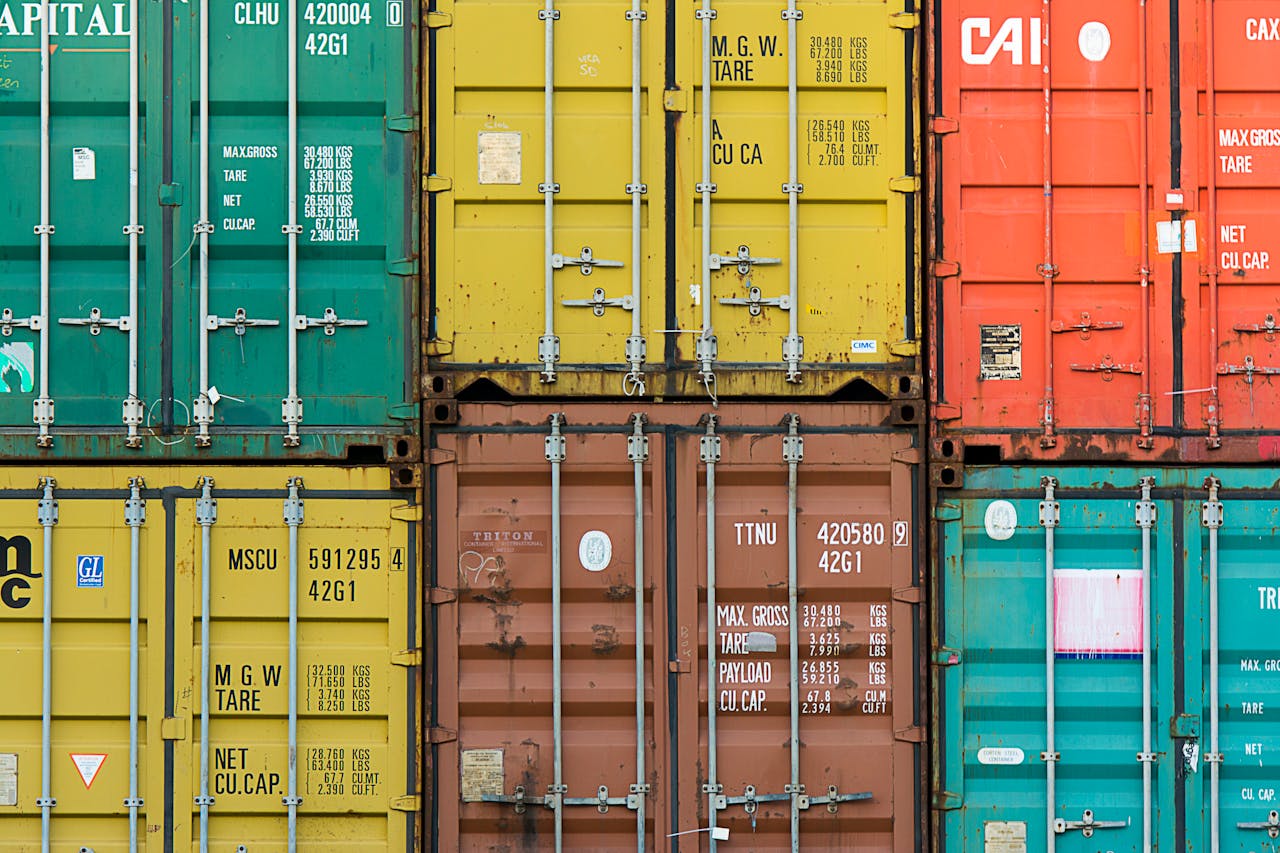 The Art of Drawing Readers In: Your attractive post title goes here Vibrant cargo containers stacked in a shipping yard highlighting global trade.